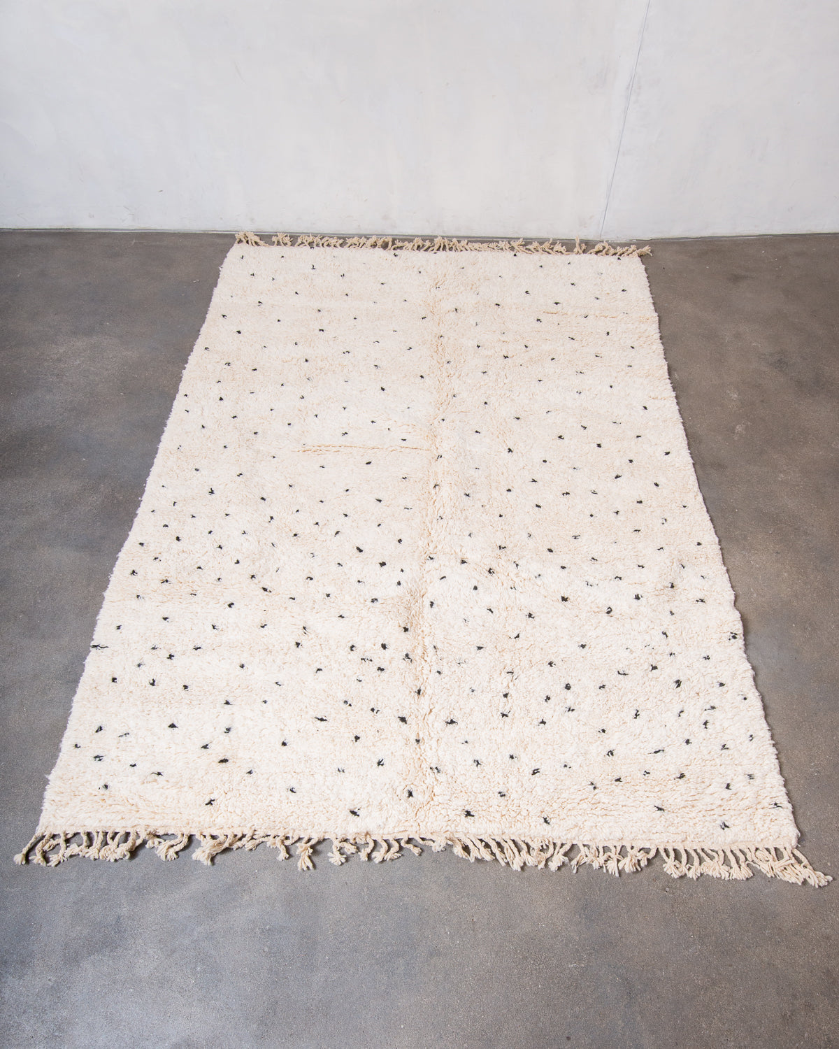 Modern, designer, handcrafted Berber rug from Morocco. Beniourain carpet with minimalist design, natural wool pile and a fluffy texture.